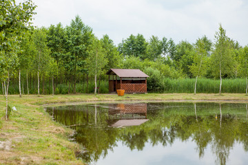 Holiday house near the lake. The concept of fishing and recreation