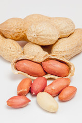 Large peeled peanuts close-up of beans in the shell. Unpeeled peanuts in the shell. Peanuts, for background or texture. Growing organic protein