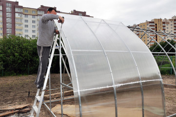 installation of domed greenhouses on the ground, consisting of steel profiles and plastic. In the...