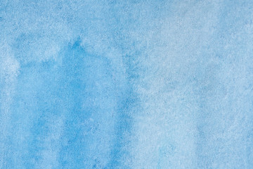 blue watercolor background, sheet of paper covered with paint with texture