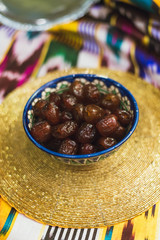 Eastern sweets in the dishes of the Middle East with gold and on Tatar cloth.