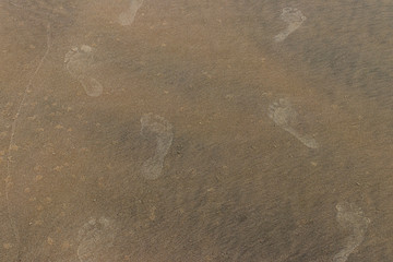 beach sand texture with footprints marks
