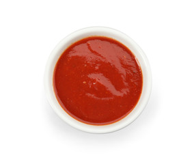 Bowl of tasty tomato sauce isolated on white, top view