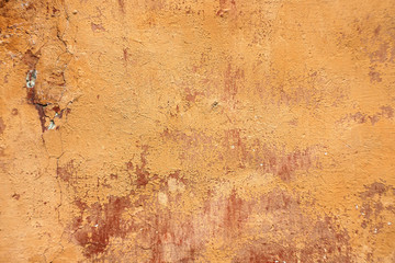 old plastered wall with battered paint