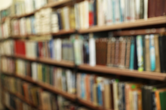 Blurred view of shelves with books in library