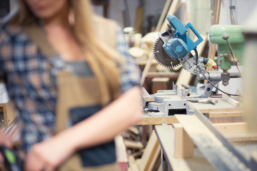 woman working in carpenter's workshop