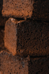 Fresh brownie as background, closeup. Delicious chocolate pie