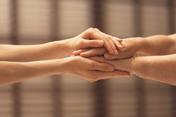 People, care and support. Giving helping hand concept