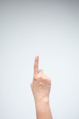 Hand pointing above on white background.