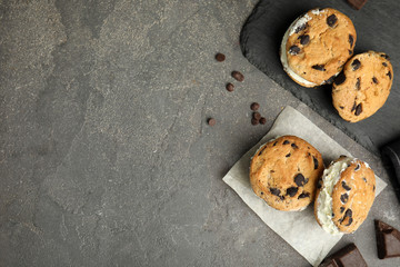 Sweet delicious ice cream cookie sandwiches served on table, flat lay. Space for text