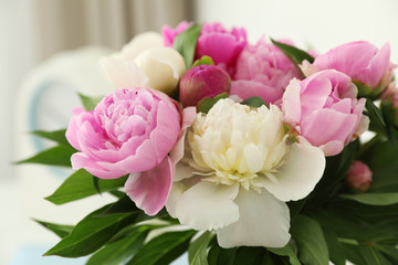 Bouquet of beautiful peonies on blurred background, closeup