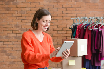 Female owner of online shopping site preparing order for client