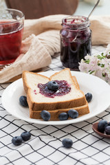 Fresh blueberries, blueberry juice, blueberry jam and bread