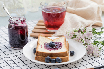 Fresh blueberries, blueberry juice, blueberry jam and bread
