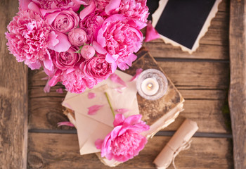 Bouquet of beautiful peonies on wooden table