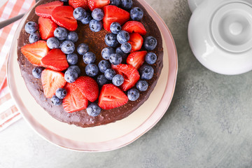 Tasty chocolate cake on grey table