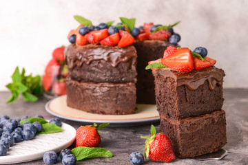 Tasty chocolate cake on grey table