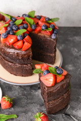 Tasty chocolate cake on grey table