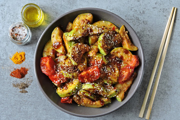 Zucchini stewed in soy sauce with spices and sesame. Squash in the Chinese style.