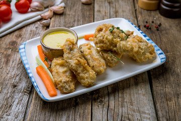 Buffalo chicken wings on wooden background