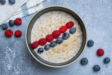 Oatmeal with berries on bowl