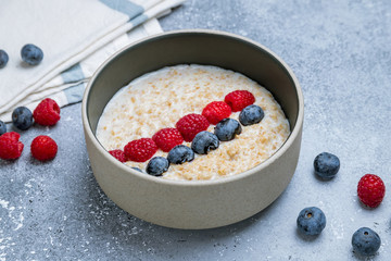 Oatmeal with berries on bowl