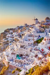 Poster Cityscape of Oia Village in Santorini Island Located on Red Volcanic Caldera Before Sunset. © danmorgan12