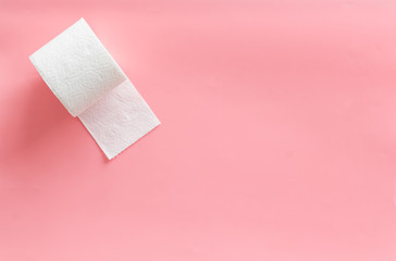 Proctology concept with toilet paper on pink background top view space for text