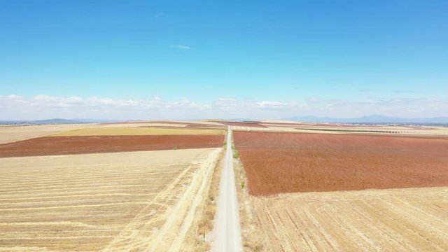 aerial view of a dirt road on a summer landscape next to Don Benito, province of Badajoz, Extremadura, Spain