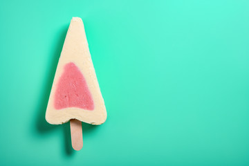 top view fresh strawberry flavor popsicle on a green background with copy space