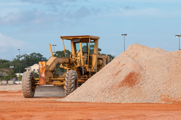 Motor Grader bulldozer heavy equipment at a construction site. - 274804515