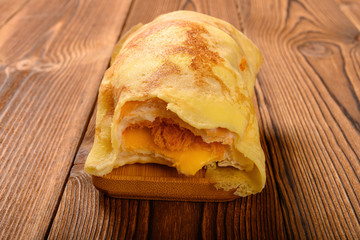 front view roll with egg and shredded pork and barbeque pork with some bites close up