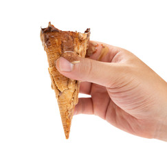hand holding the last bit of a coffee flavor ice cream cone on white background with clipping path