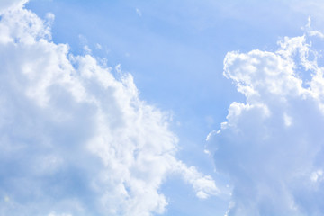 Naklejka na ściany i meble Blue sky background and fluffy white cloud in sunny day