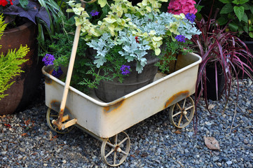 Cute wagon flower planter © perlphoto