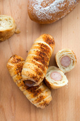 Bread with sausage bakery set up on wood plate in a bakery restaurant. -Image