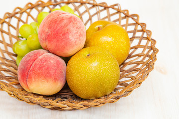 Muscat grape ,peach,peer on the basket