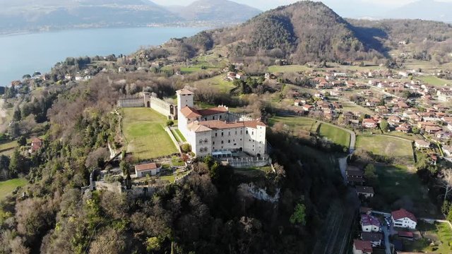 A circle flight of a Mavic Air drone around the Rocca di Angera in a perfect spring sunny day