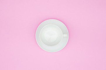 Vintage white coffee cup empty on  pink pastel background. Copy space