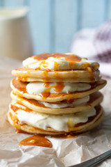 stack of pancakes with honey and syrup