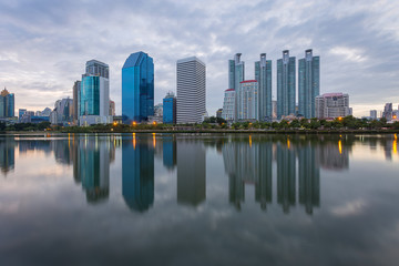 City building with water reflection before sunset