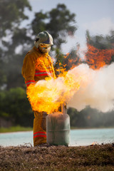 Obraz premium Firefighter with fire and suit for protect fire fighter for training firefighters.