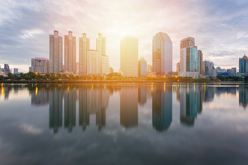 Fototapeta premium City building with water reflection before sunset