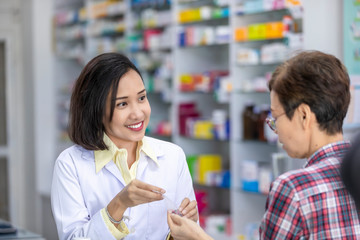 pharmacist talk to female patient in pharmacies