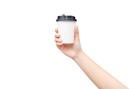 Take away coffee cup background. Female hand holding a coffee paper cup isolated on white background with clipping path.