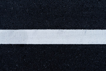 Fototapeta premium New white traffic lines on the road.