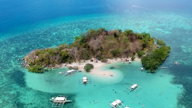 Aerial wide shot of CYC beach on CYC Island, Coron town, Philippines