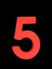 Plastic number isolated on black background, number 5