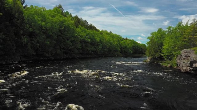 Lifting up over the rapids above a waterfall on the Penobscot River AERIAL