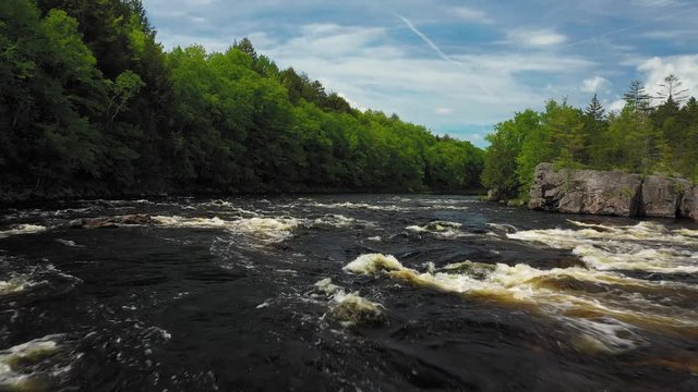 Flying low over the rapids above a waterfall on the Penobscot River AERIAL